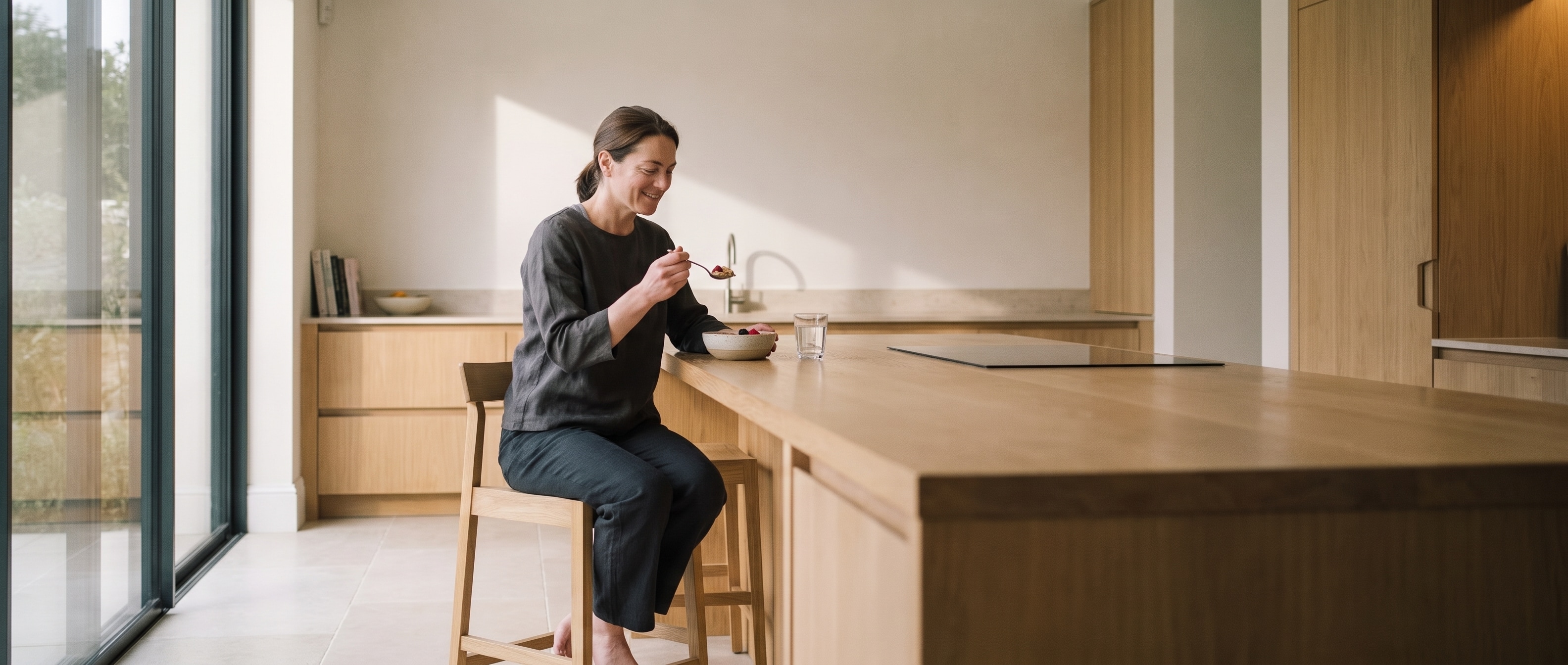 Woman checking her daily plan beside breakfast